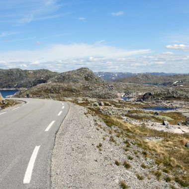 Norwegian road, mountains in the distance.