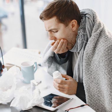 Sick man drinking tea.