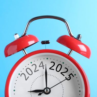A clock with the dates "2024" and "2025". The hand has stopped between them.